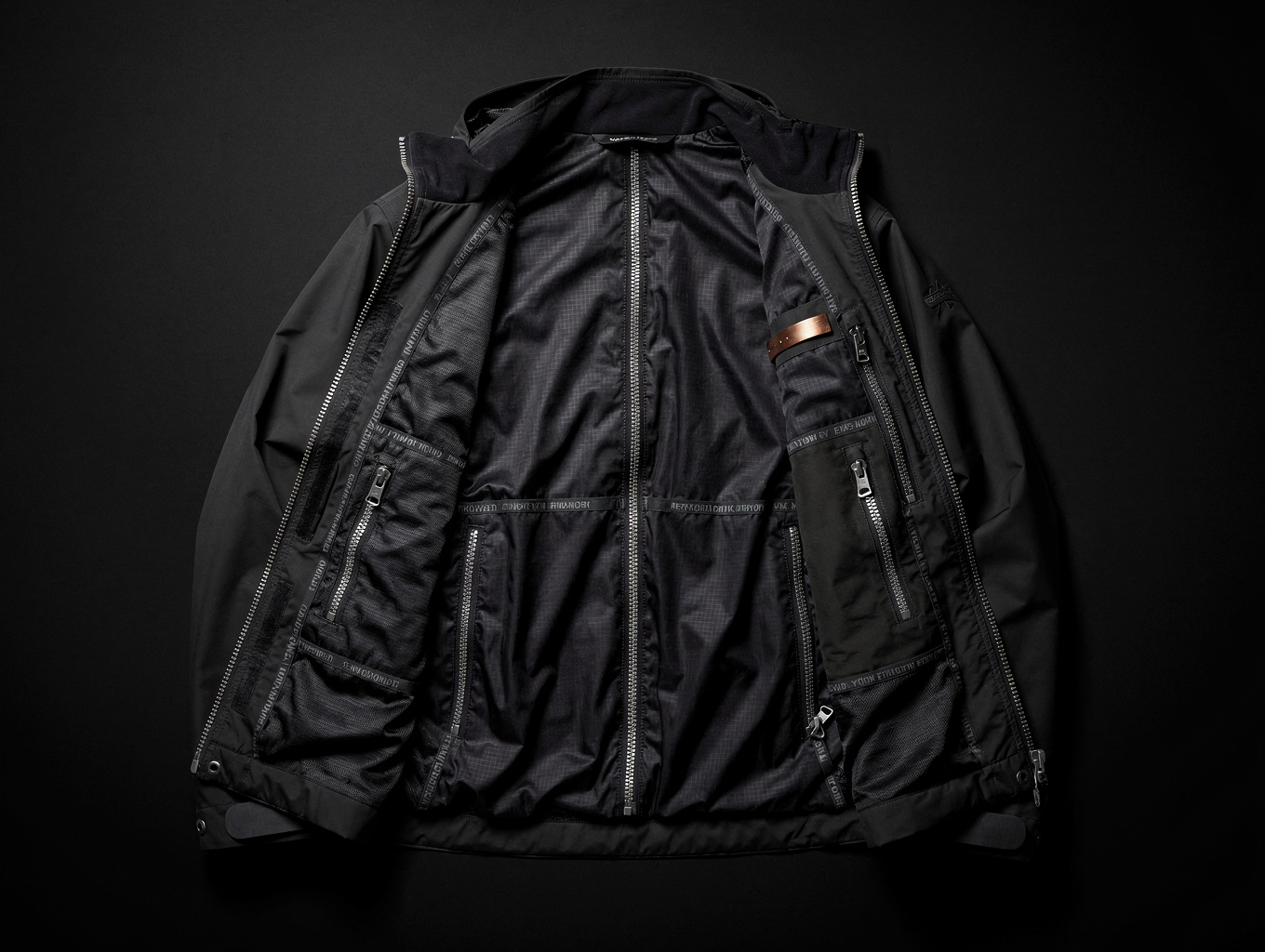 Weather-resistant outerwear technical parka and insulated vest detailing zipper hardware