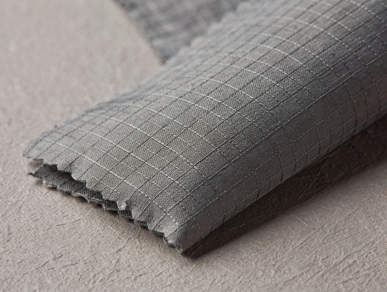 Close-up of technical ripstop fabric with waterproof membrane backing